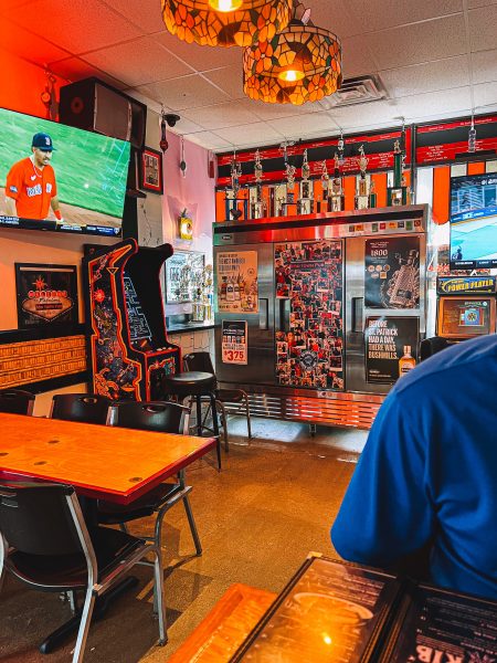A man sitting at a table in a restaurant.