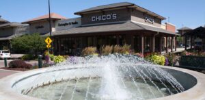 a water fountain in front of a store