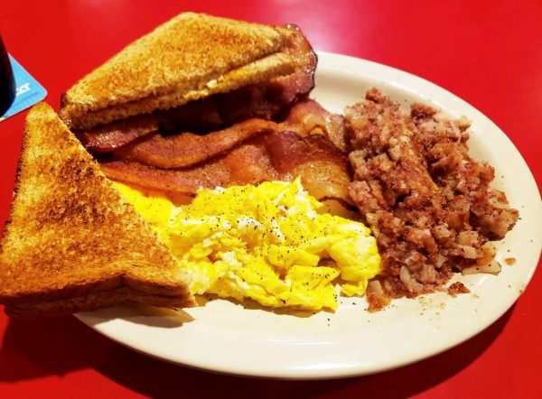 A plate of breakfast food on a table.