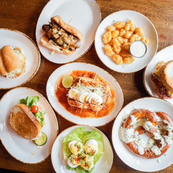A group of plates of food on a table.