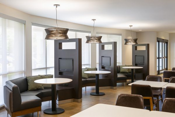 A room with tables and chairs.