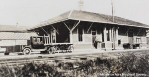 a black and white photo of a train station