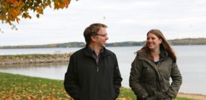 a man and a woman standing next to each other
