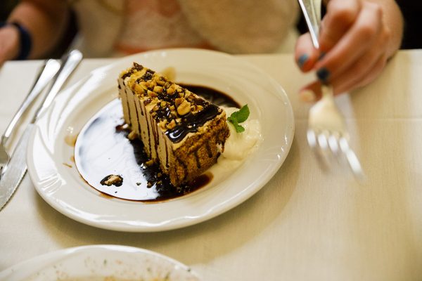 A piece of cake on a white plate.