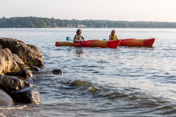 a couple of people that are in a kayak.