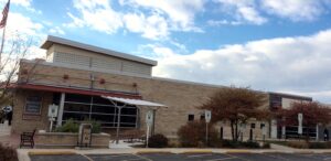 a building with a flag on the outside of it